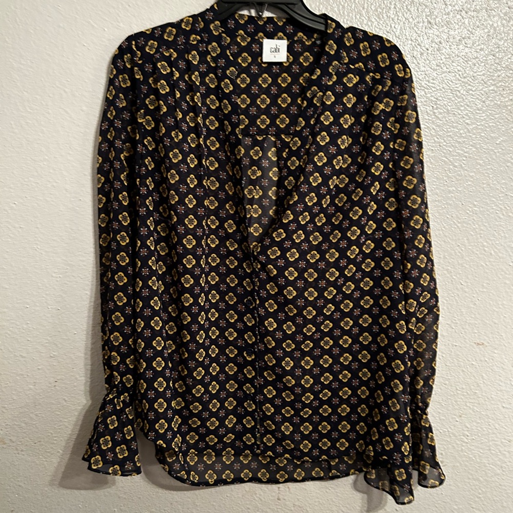 Sheer long bell sleeve, buttons up. Zoomed in on details in pictures
